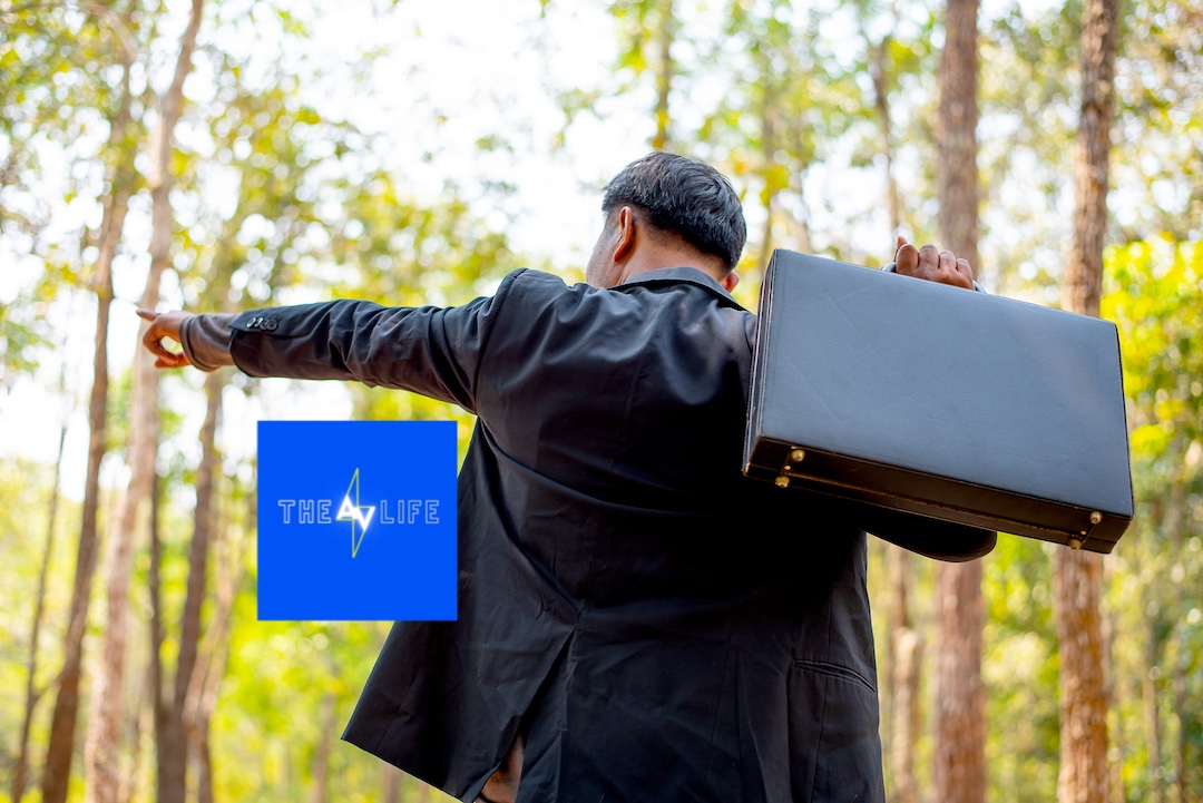 business-man-with-black-suit-and-briefcase-look-to-2023-11-27-04-58-34-utc