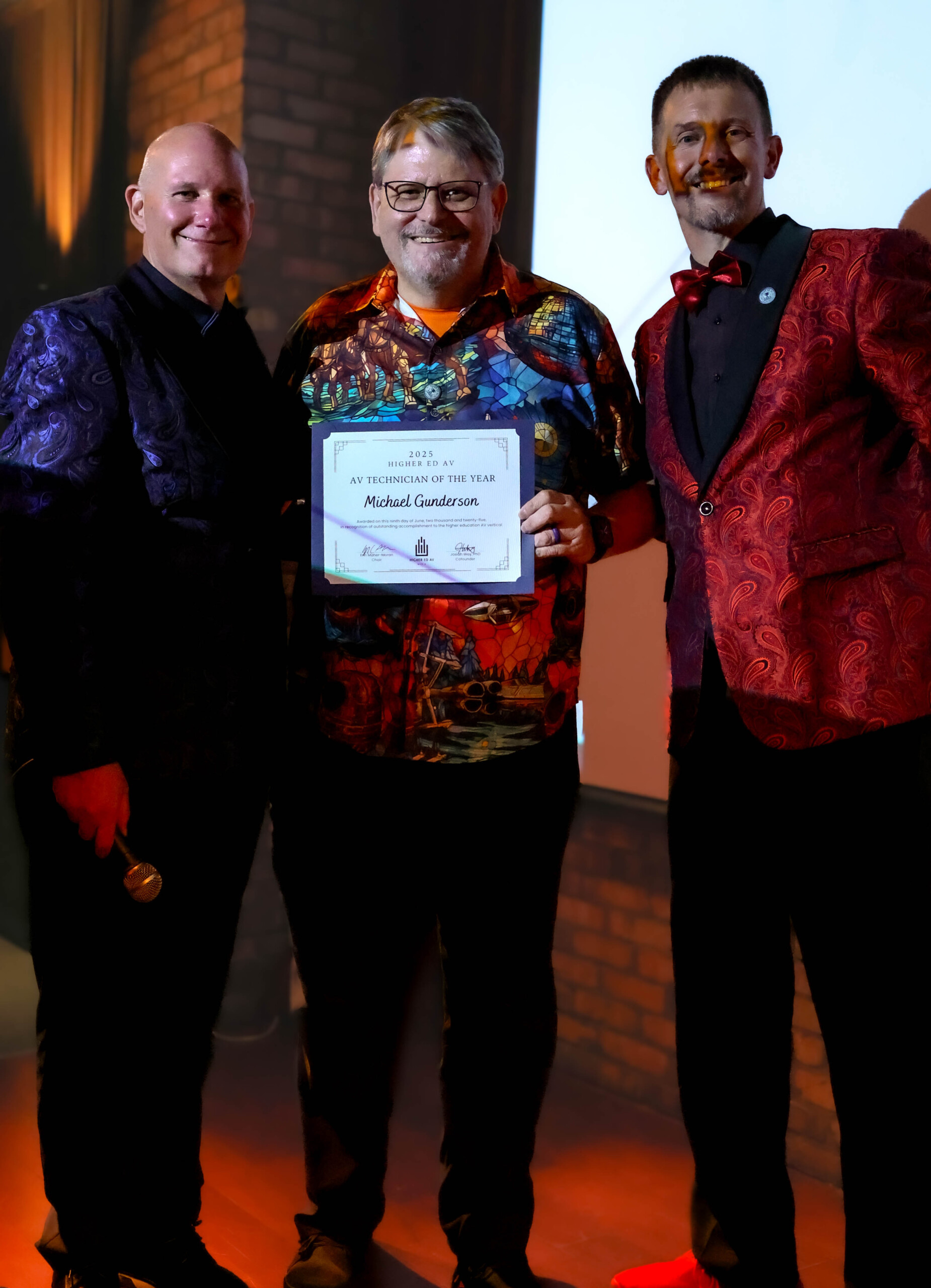 Michael receiving the AV Technician of the Year 2025 award.