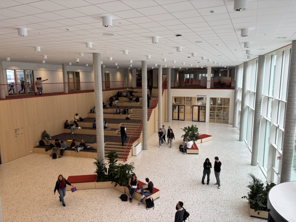 Open gathering space with stairs inside Thomas More.