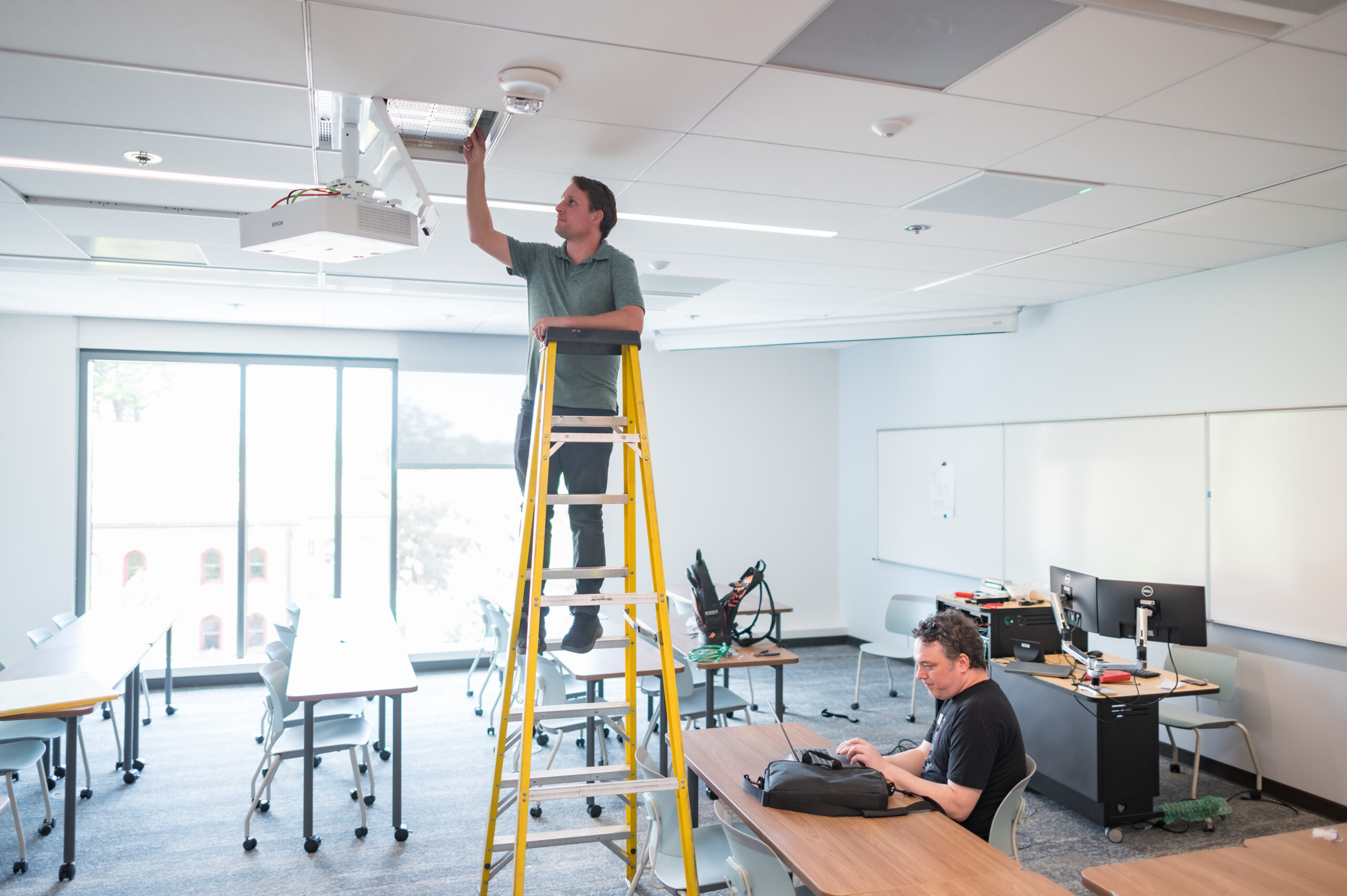 Matt working on a ladder