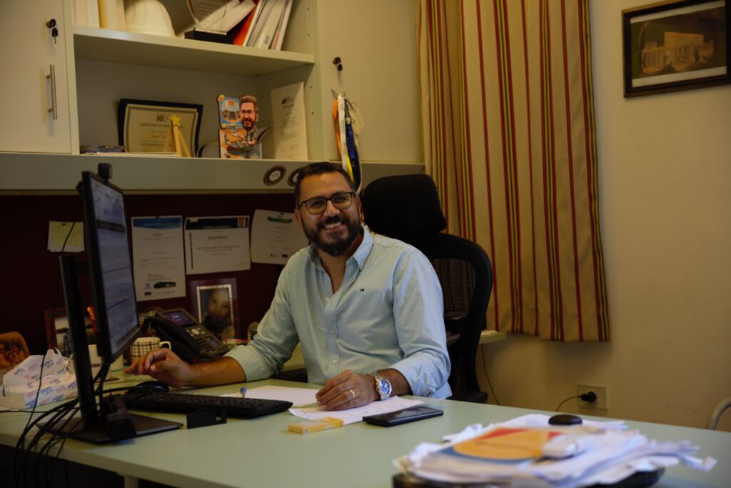 Sameh at a desk