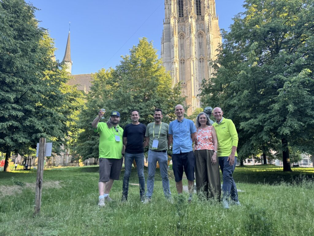 The crew by a tower