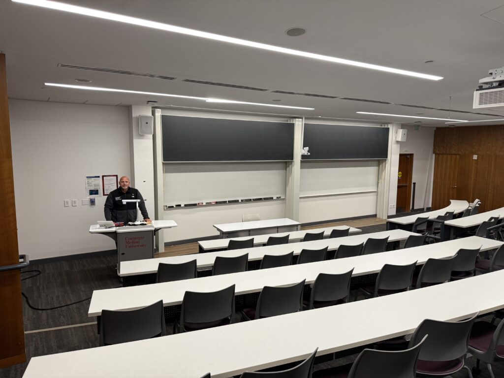 Dan at lectern wide shot